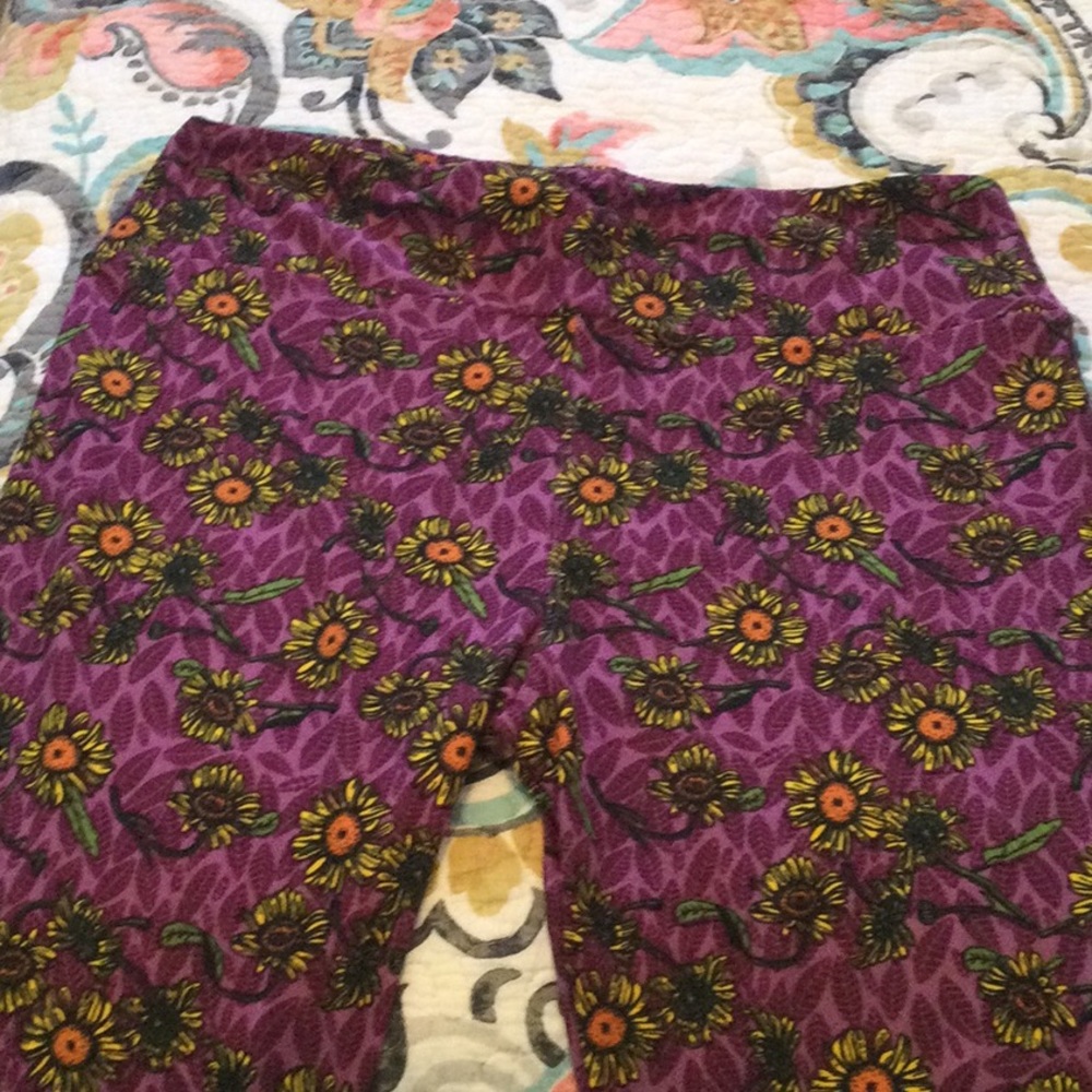 Brand new Lularoe Leggings, Size TC. Purple with Floral pattern in yellow, green